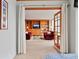 Spacious living room with built-in shelving and large windows, as seen from the bedroom at 3100 E Cherry Creek South Dr # 1507, Denver, CO 80209