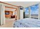 Inviting bedroom opens to a living area with built-in shelving and comfortable, inviting furniture at 3100 E Cherry Creek South Dr # 1507, Denver, CO 80209
