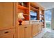Living room with wood built-ins and shelves near windows with a city view at 3100 E Cherry Creek South Dr # 1507, Denver, CO 80209