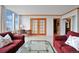Inviting living room with french doors to the bedroom and plenty of natural light at 3100 E Cherry Creek South Dr # 1507, Denver, CO 80209