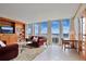 Spacious living room with large windows and custom built-in shelving at 3100 E Cherry Creek South Dr # 1507, Denver, CO 80209