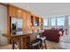 The open floor plan seamlessly integrates the kitchen, living room, and stunning city views from the expansive windows at 3100 E Cherry Creek South Dr # 1507, Denver, CO 80209
