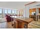 Open living space shows the transition between the kitchen, living room, and large windows with city views at 3100 E Cherry Creek South Dr # 1507, Denver, CO 80209