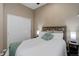 Comfortable bedroom featuring a double door closet and a cozy bed at 24621 E Berry Pl, Aurora, CO 80016