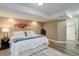 Cozy bedroom with neutral decor, wood-look flooring, and comfortable, bright lighting at 24621 E Berry Pl, Aurora, CO 80016