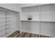 Walk-in closet with wooden floors and built in shelving and rack at 24621 E Berry Pl, Aurora, CO 80016