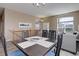Inviting dining room with stylish table and chairs, connecting to a living space with plenty of natural light at 24621 E Berry Pl, Aurora, CO 80016