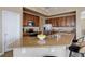 Well-lit kitchen featuring granite countertops, wood cabinets and stainless steel appliances at 24621 E Berry Pl, Aurora, CO 80016