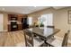 Eat-in kitchen features natural lighting, dark appliances, and wood-look flooring at 24621 E Berry Pl, Aurora, CO 80016