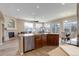 Spacious open-concept kitchen with granite countertops, wood cabinets and stainless-steel appliances at 24621 E Berry Pl, Aurora, CO 80016