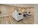 Well-lit living room offers sleek decor, recessed lighting, and elegant, neutral color palette at 24621 E Berry Pl, Aurora, CO 80016