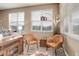 Inviting living room with stylish chairs, unique table, and plenty of natural light at 24621 E Berry Pl, Aurora, CO 80016