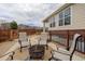 Cozy patio with comfortable seating around a fire pit, great for relaxing outdoors at 24621 E Berry Pl, Aurora, CO 80016