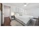 Bright bedroom featuring a ceiling fan, neutral decor, and a walk-in closet at 8981 E Amherst Dr # E, Denver, CO 80231