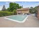 Smaller fenced pool perfect for children with nearby pool house and trees at 8981 E Amherst Dr # E, Denver, CO 80231