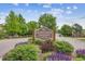 Entrance sign for Cherry Creek Meadows shows the well-maintained community and landscaping at 8981 E Amherst Dr # E, Denver, CO 80231