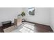Bright office space with hardwood floors and a large window for natural light at 8981 E Amherst Dr # E, Denver, CO 80231