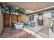 Cozy covered patio features a hot tub, seating, and shade for relaxing outdoors at 8981 E Amherst Dr # E, Denver, CO 80231