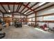 Spacious barn interior featuring ample space and natural lighting, perfect for a workshop or storage at 29263 Sue Rd, Evergreen, CO 80439