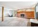 Inviting finished basement area featuring a brick fireplace and walkout access at 29263 Sue Rd, Evergreen, CO 80439