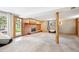 Finished basement with brick fireplace, abundant natural light, and direct access to the outdoors at 29263 Sue Rd, Evergreen, CO 80439