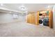 Functional finished basement with laundry area and ample closet space at 29263 Sue Rd, Evergreen, CO 80439