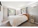Serene bedroom with soft lighting, neutral color palette, and plush carpeting at 29263 Sue Rd, Evergreen, CO 80439