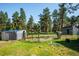 Exterior view featuring a horse and an outbuilding at 29263 Sue Rd, Evergreen, CO 80439