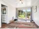 Bright sunroom featuring sliding doors to a porch and backyard views, providing a serene space to relax at 29263 Sue Rd, Evergreen, CO 80439