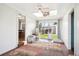 Sunroom with a view of a backyard featuring a sliding door and comfortable space for relaxing or entertaining at 29263 Sue Rd, Evergreen, CO 80439