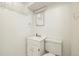 Small basement bathroom with toilet and vanity at 11040 Emerson St, Northglenn, CO 80233