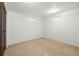 Ample basement room with carpeted floor and neutral walls at 11040 Emerson St, Northglenn, CO 80233