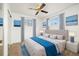 Main bedroom with a king-size bed and blue accents at 11040 Emerson St, Northglenn, CO 80233