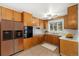 Kitchen with wood cabinets and modern appliances at 11040 Emerson St, Northglenn, CO 80233