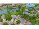 Breathtaking aerial view of the property, showcasing its proximity to lush landscaping and a serene lake at 3237 W 113Th Ave, Westminster, CO 80031
