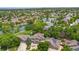 Aerial view of home in quiet neighborhood, mature trees, pond, well-manicured lawns, solar panels on neighboring homes at 3237 W 113Th Ave, Westminster, CO 80031