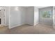 Comfortable bedroom with neutral walls, carpeted floors, double-hung windows and access to an ensuite bathroom at 3237 W 113Th Ave, Westminster, CO 80031