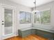 Bright breakfast nook with built-in bench seating, a pendant light, and views of the backyard at 3237 W 113Th Ave, Westminster, CO 80031