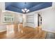 Stylish dining area featuring hardwood floors, a modern chandelier, and easy access to other rooms at 3237 W 113Th Ave, Westminster, CO 80031
