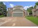 Charming two-story home with stone accents, a large driveway, and an attached two-car garage at 3237 W 113Th Ave, Westminster, CO 80031