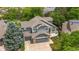 Aerial view of a charming two-story home with a three-car garage and mature landscaping at 3237 W 113Th Ave, Westminster, CO 80031