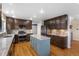 Beautiful kitchen featuring a blue island, stainless steel appliances, and dark wood cabinets at 3237 W 113Th Ave, Westminster, CO 80031