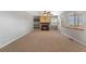 Inviting living room with a fireplace, floating shelves, and windows providing natural light at 3237 W 113Th Ave, Westminster, CO 80031