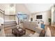 Bright living room featuring hardwood floors, neutral paint, and a seamless flow into the dining area at 3237 W 113Th Ave, Westminster, CO 80031