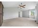 A well-lit bedroom with neutral walls, carpet flooring, a ceiling fan and two windows bringing in plenty of natural light at 3237 W 113Th Ave, Westminster, CO 80031