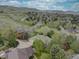 Panoramic aerial view of the home and surrounding neighborhood with beautiful mountain views at 13959 W Cedar Pl, Golden, CO 80401