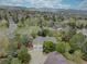 Beautiful aerial view of the property nestled among mature trees, showcasing the surrounding landscape at 13959 W Cedar Pl, Golden, CO 80401