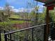 Balcony offering a view of lush greenery and a serene backyard, ideal for relaxation and outdoor enjoyment at 13959 W Cedar Pl, Golden, CO 80401