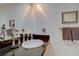 Stylish bathroom featuring a sleek vanity with a vessel sink and a large mirror that enhances the space at 13959 W Cedar Pl, Golden, CO 80401
