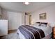 Bedroom with closet and dresser, offering a simple and functional space at 13959 W Cedar Pl, Golden, CO 80401